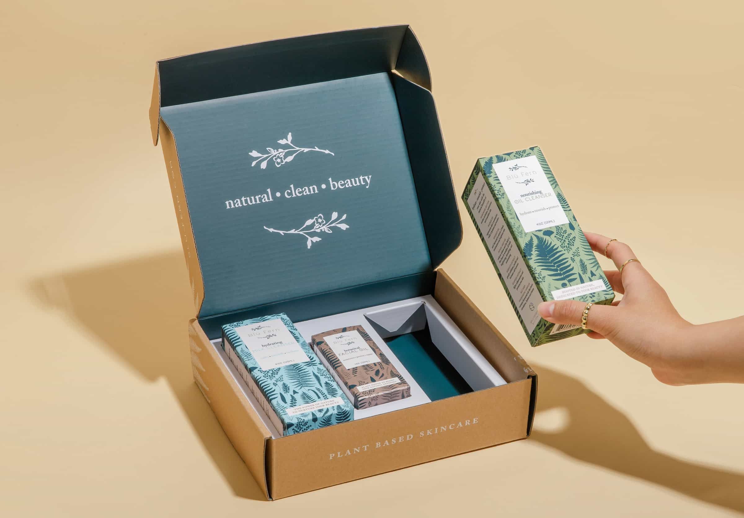 Blu Fern packaging mailer box set with multiple products and custom insert for security.