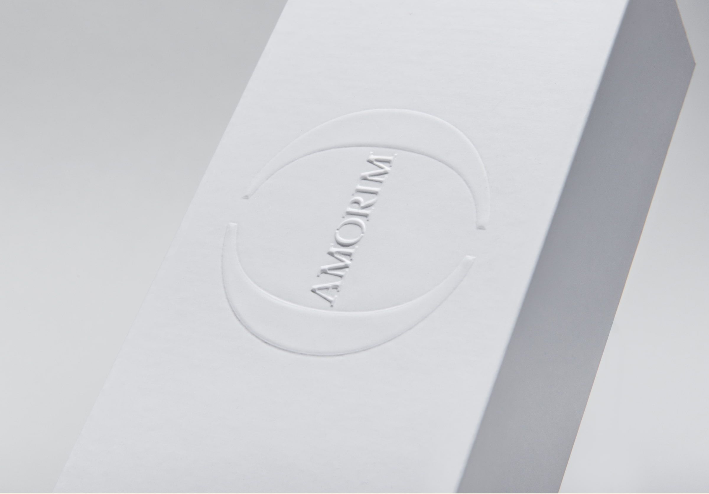 Embossing on white rigid box.