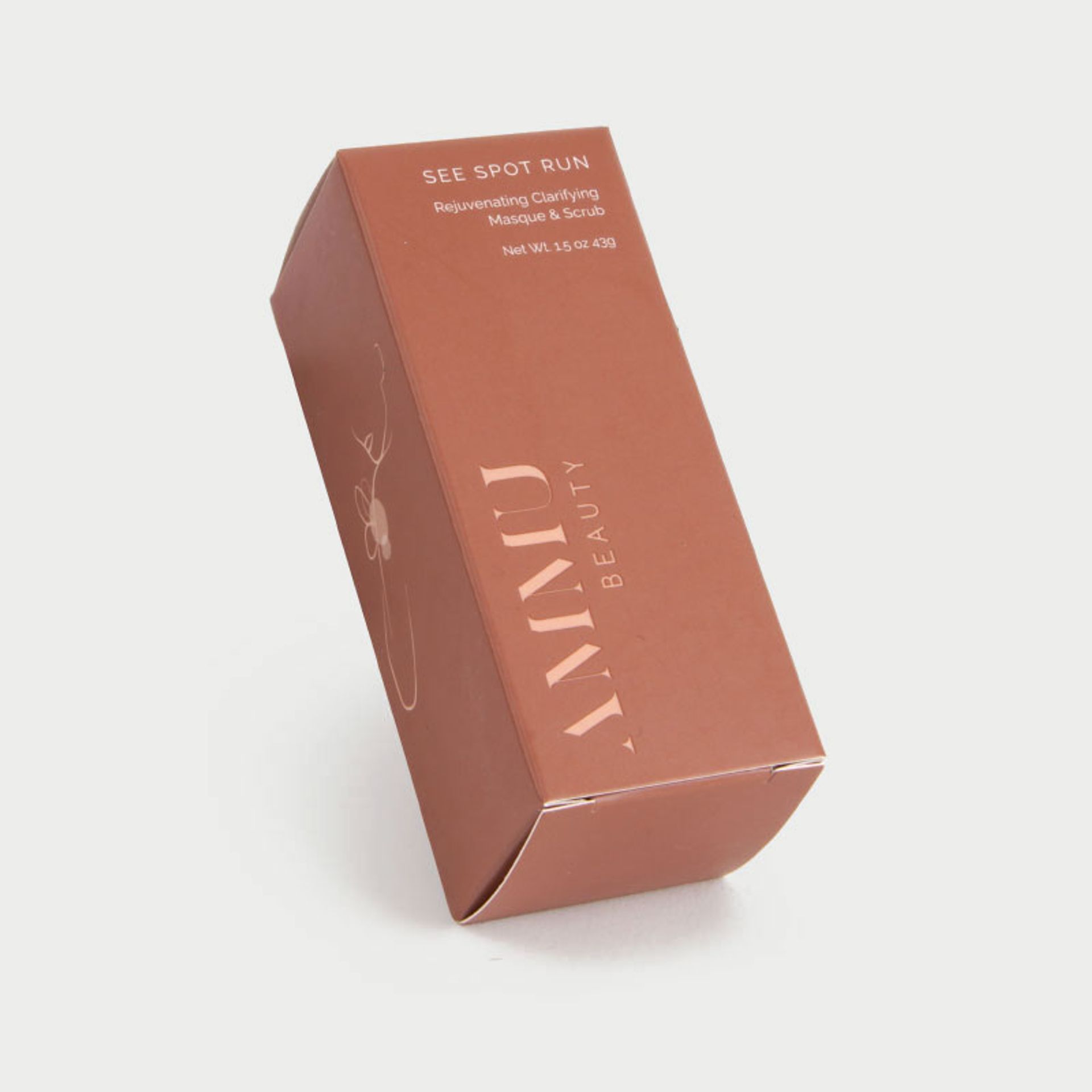 Closed terracotta box for Ammu Beauty See Spot Run masque and scrub on a white background.