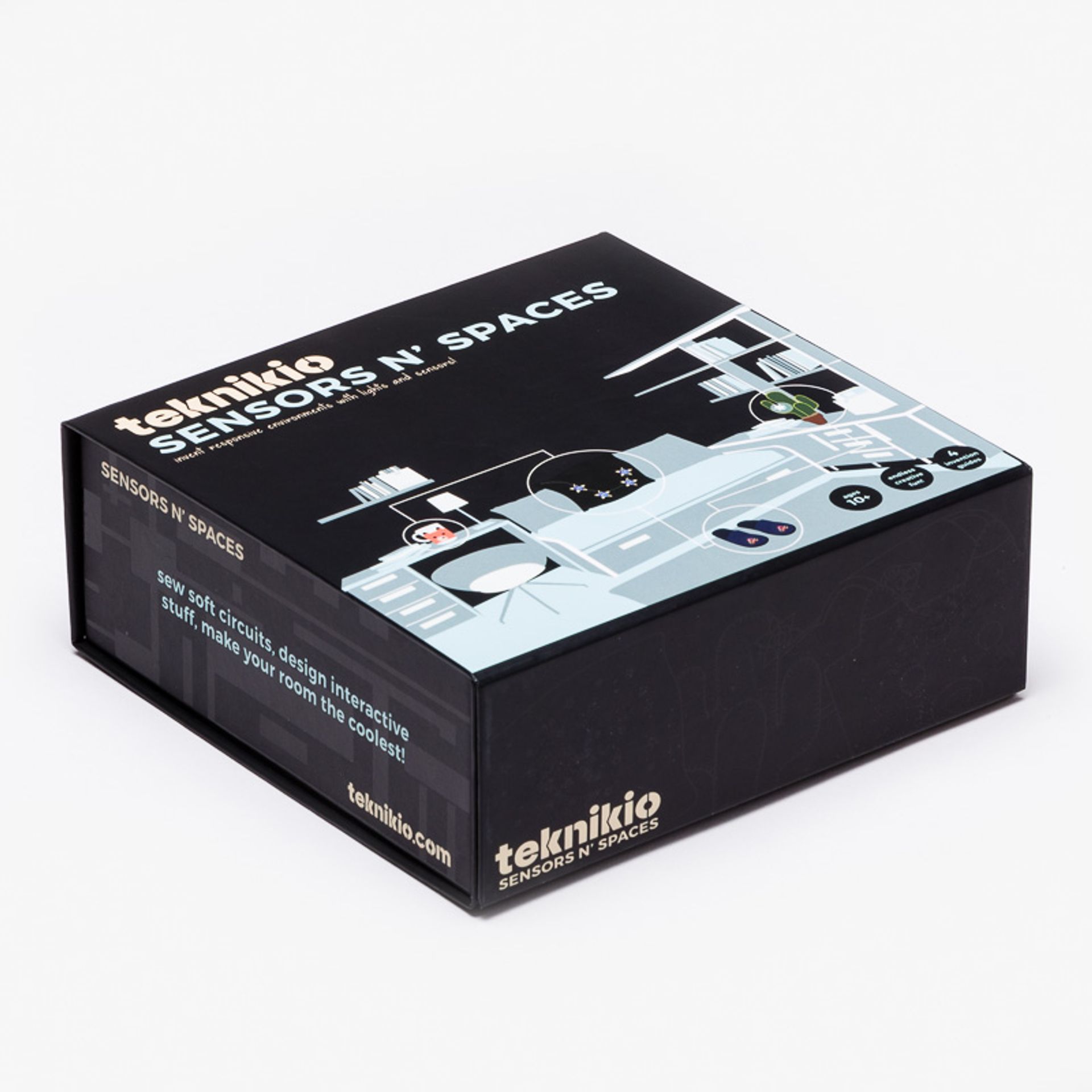 Closed black Teknikio Sensors N' Spaces rigid box featuring an illustration of a modern bedroom on the lid.
