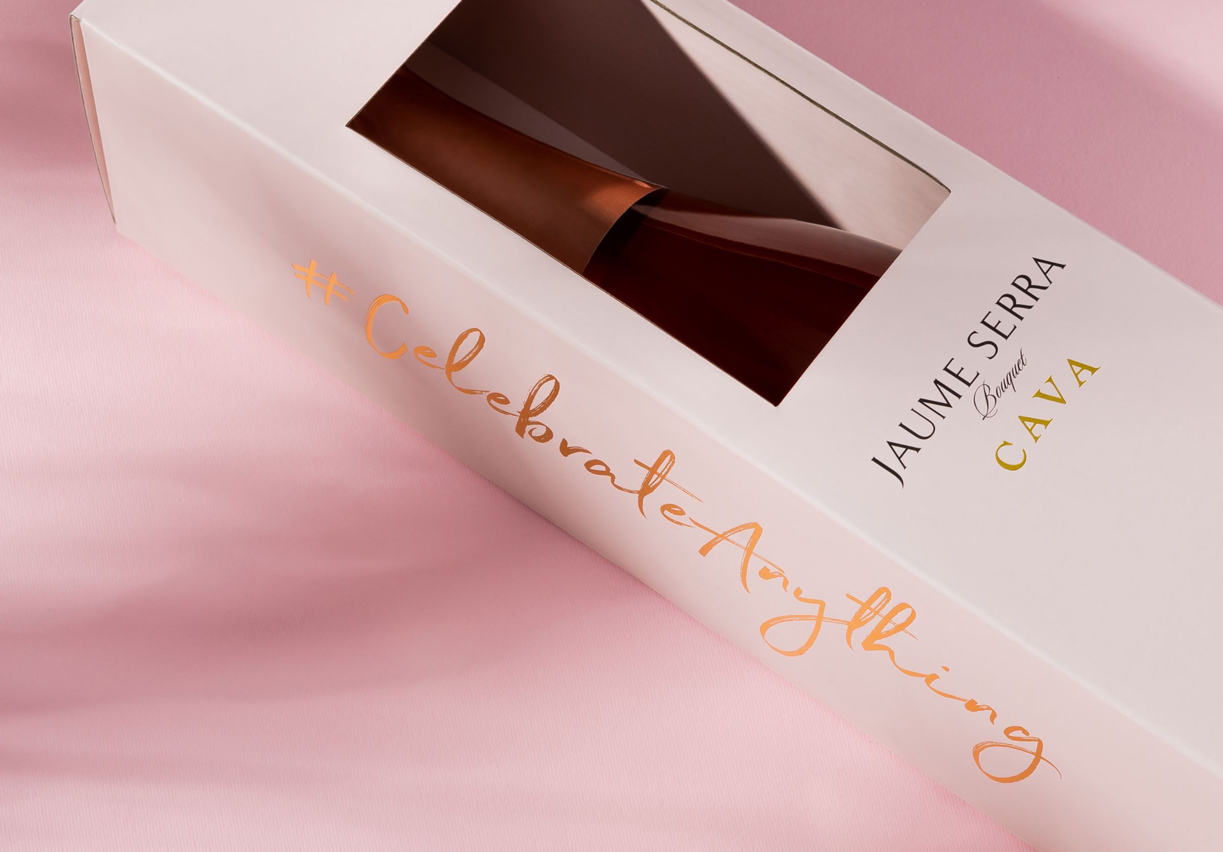 Wine cardboard packaging with gold foil stamping.
