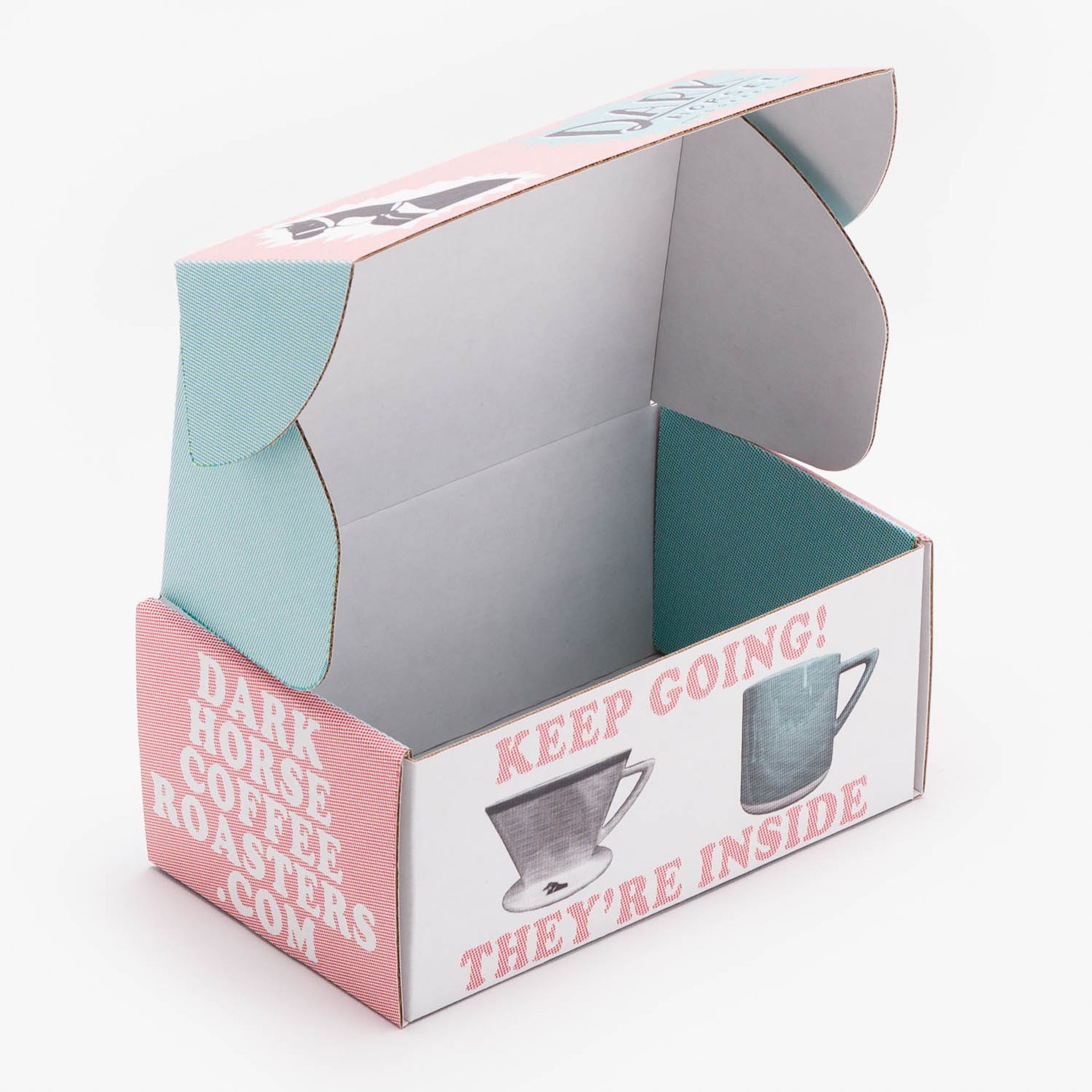 Open, empty Dark Horse Coffee mailer box showing printed interior flaps and bottom illustrations.