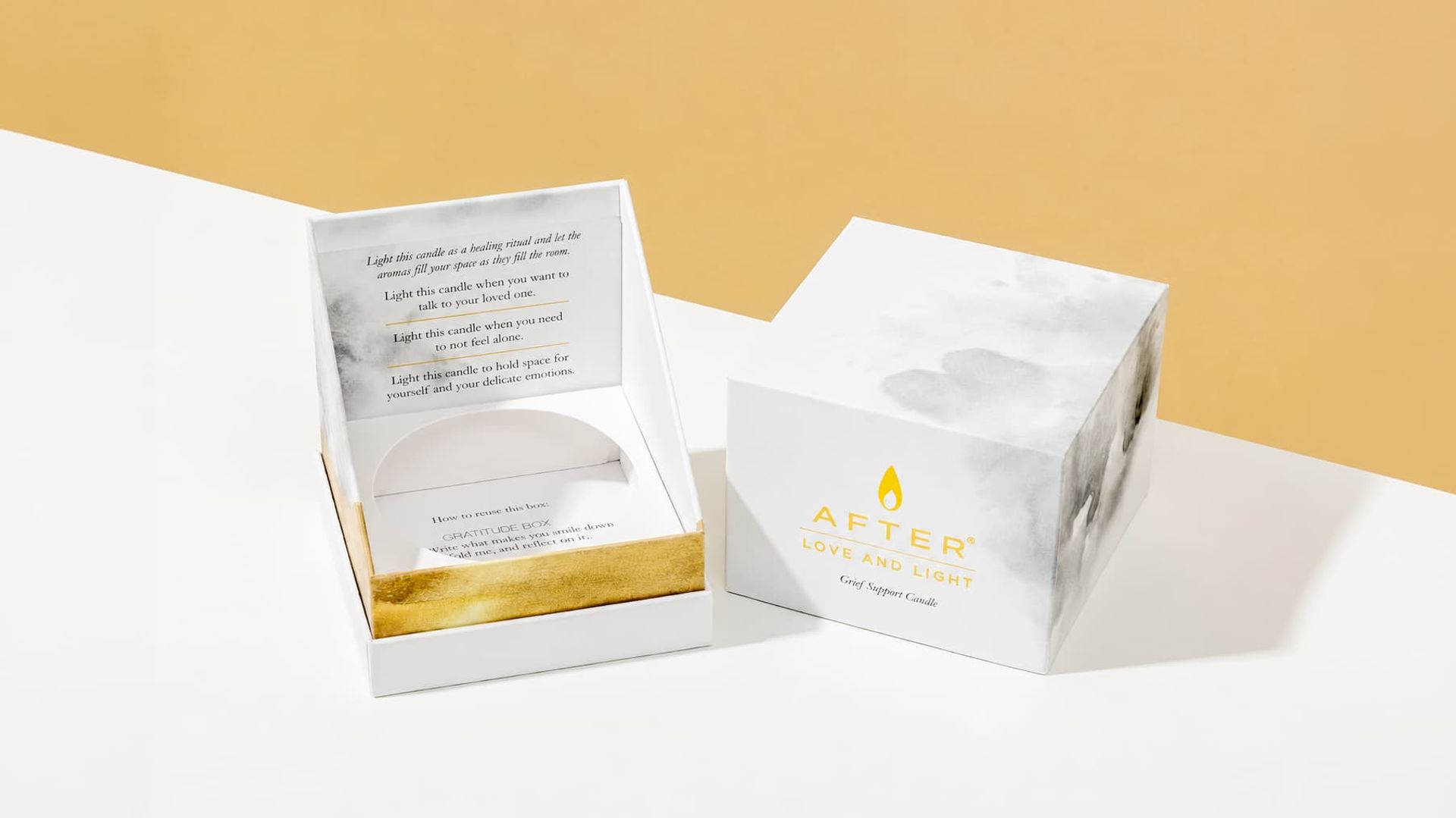 Open AFTER grief support candle boxes with gold foil logos, grey watercolor wash, and printed lids.
