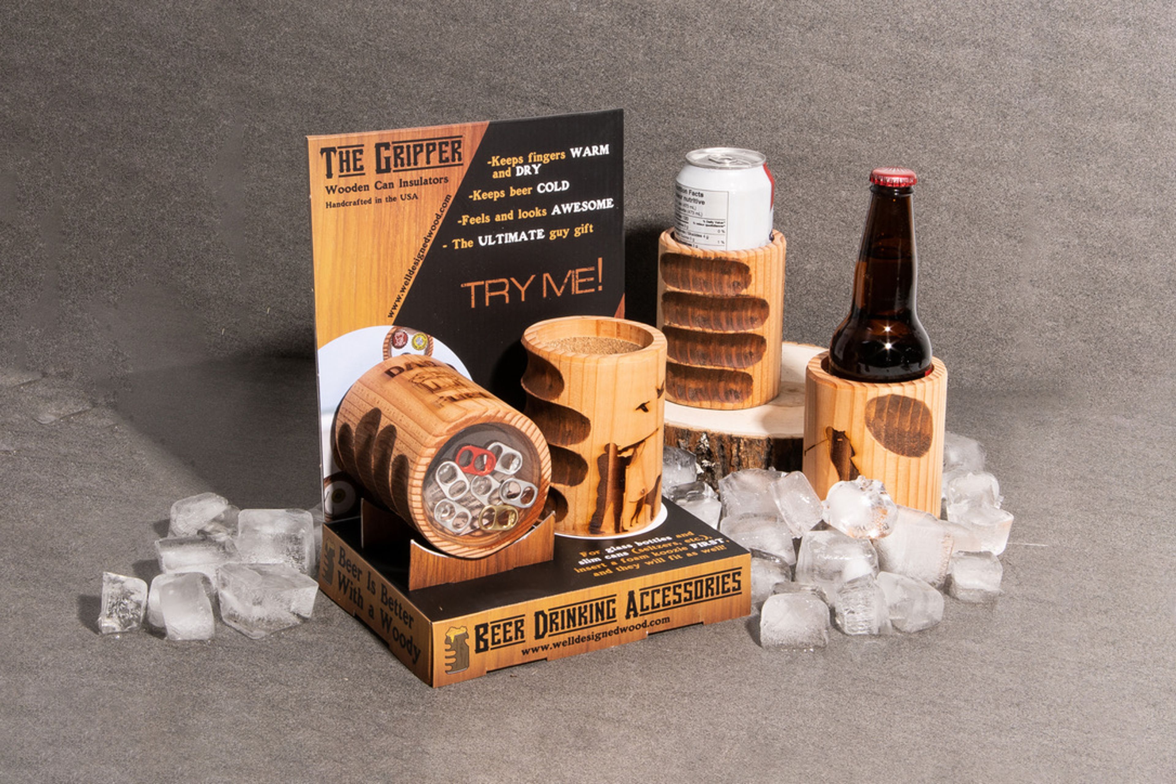 The Gripper wooden can insulators in a retail POP display holding a beer bottle and can among ice.
