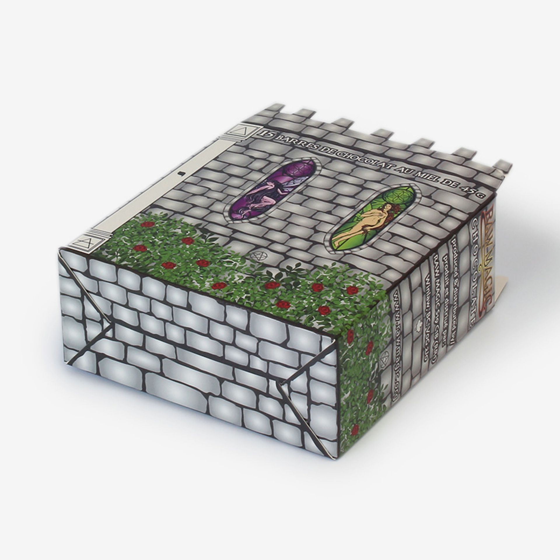 Closed Raw Magic Chocolate display box designed like a stone castle wall with stained glass windows and rose bushes.