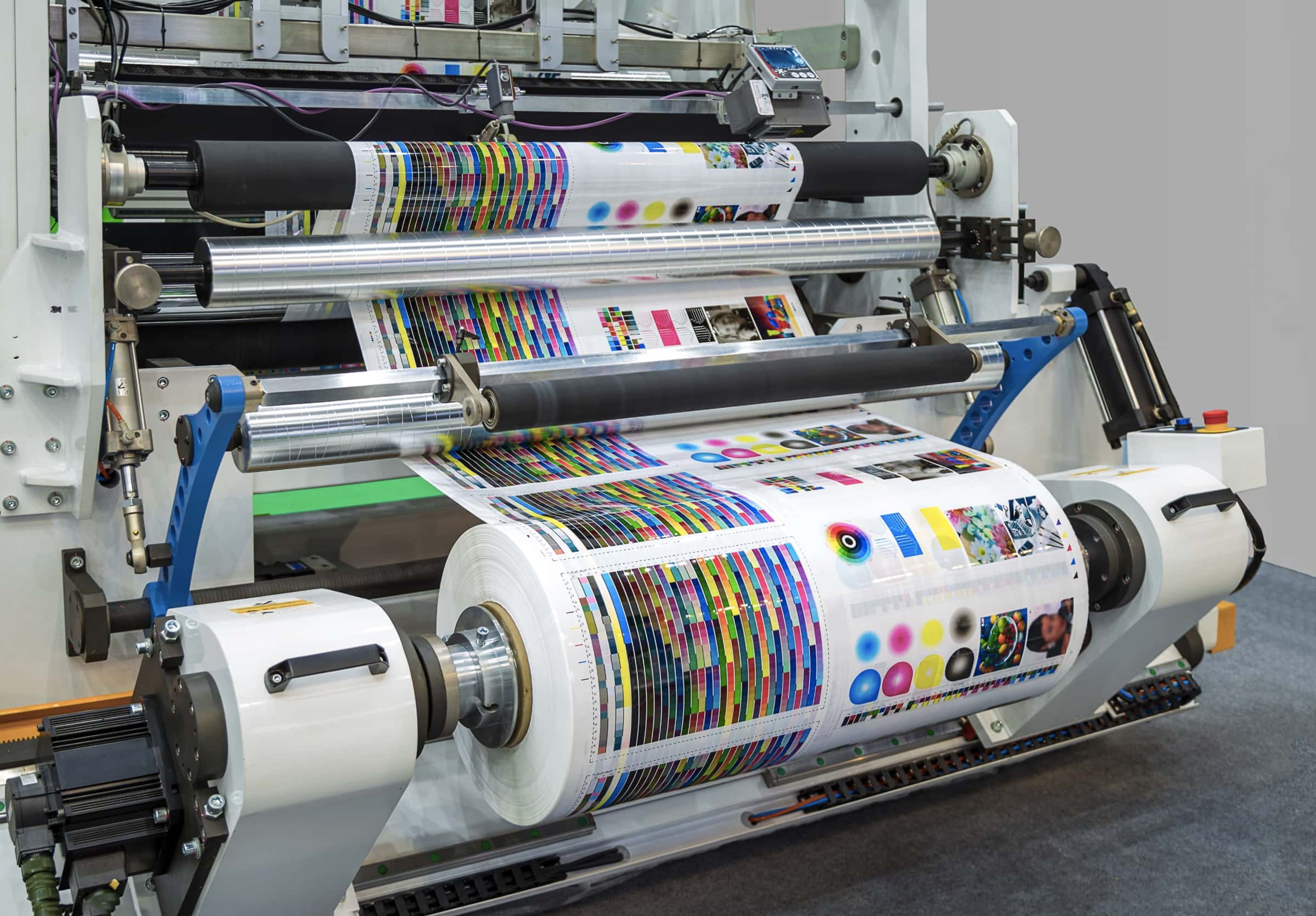 Web offset printing machine with roll of paper.
