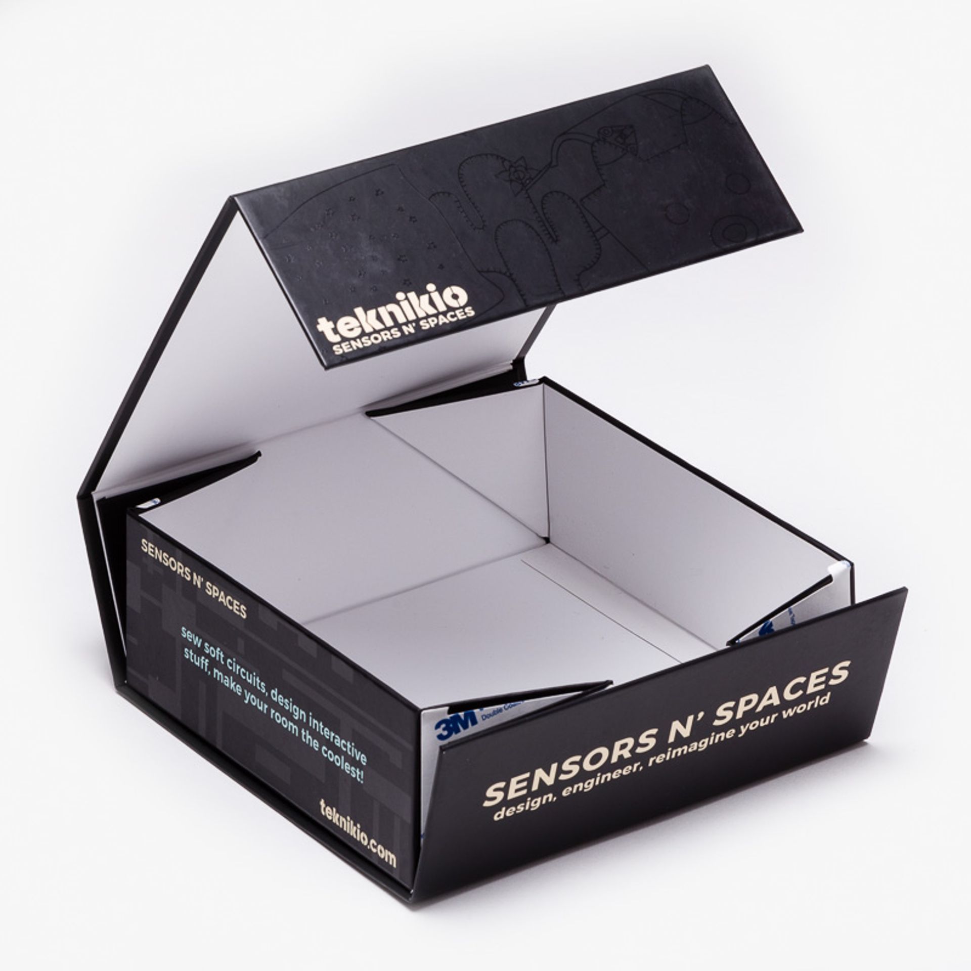 Open, empty Teknikio Sensors N' Spaces black rigid box displaying its fold-out magnetic flap and white interior.