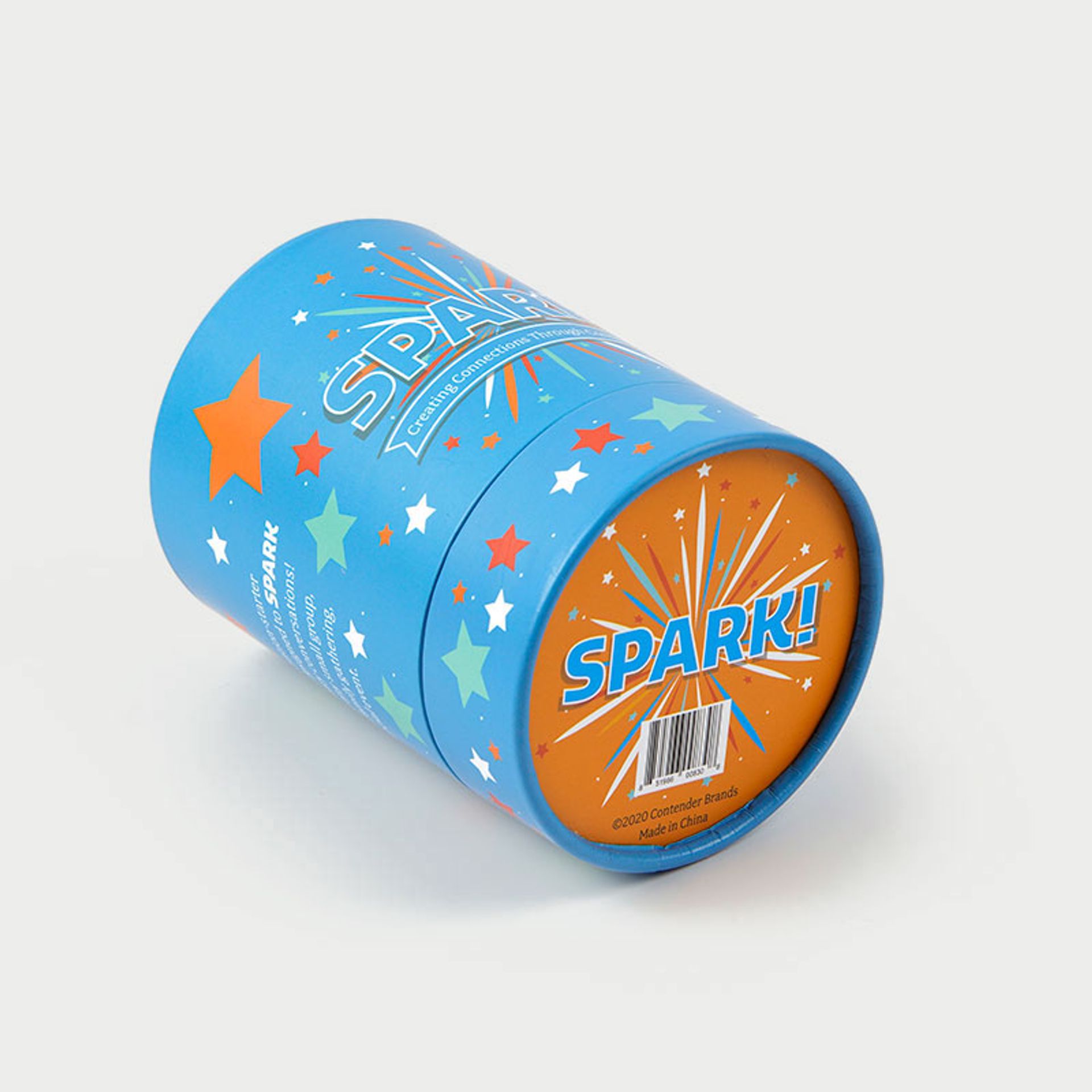 A bright blue Spark! conversation card game cylinder box resting on its side against a white background.