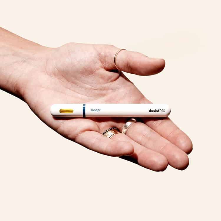 female hand grabbing an edible from a jar