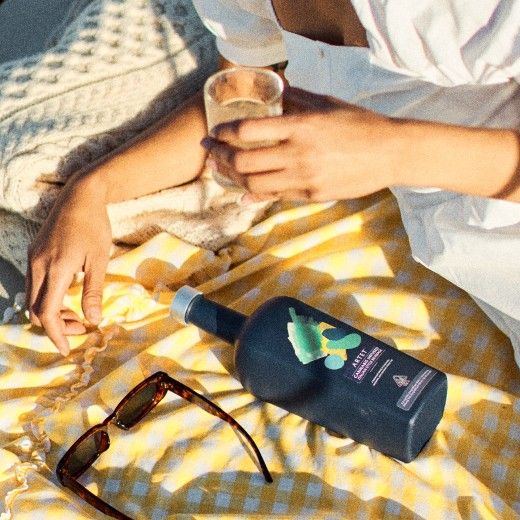 female hand grabbing an edible from a jar
