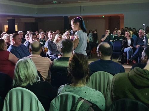 Image of people laughing in a comedy venue