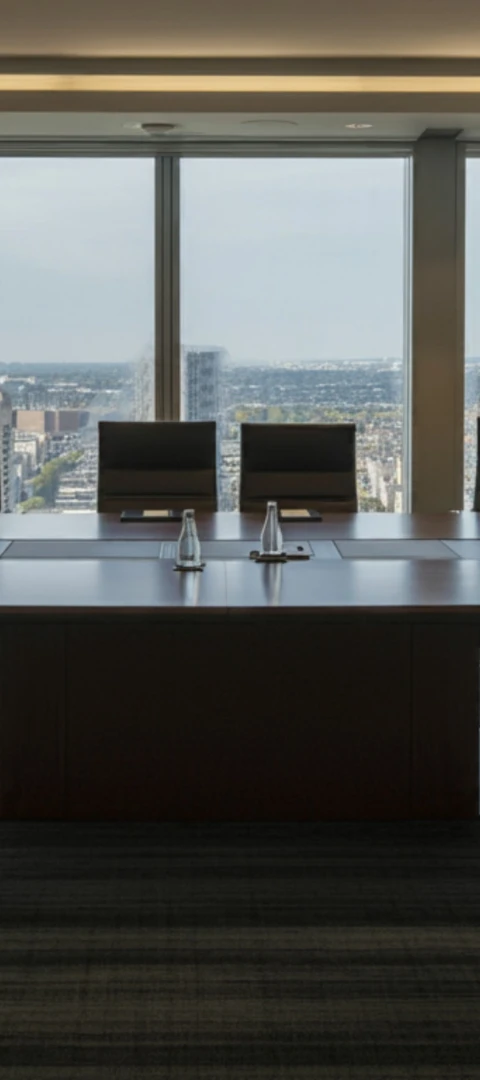 group of business people figuring out puzzle pieces depciting restructuring