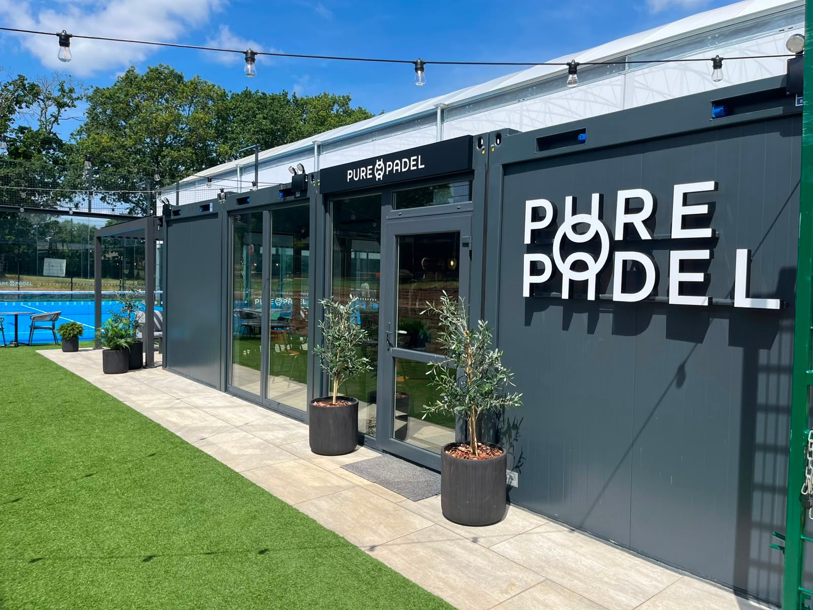 Pure Padel club house entrance with exterior and festoon lighting