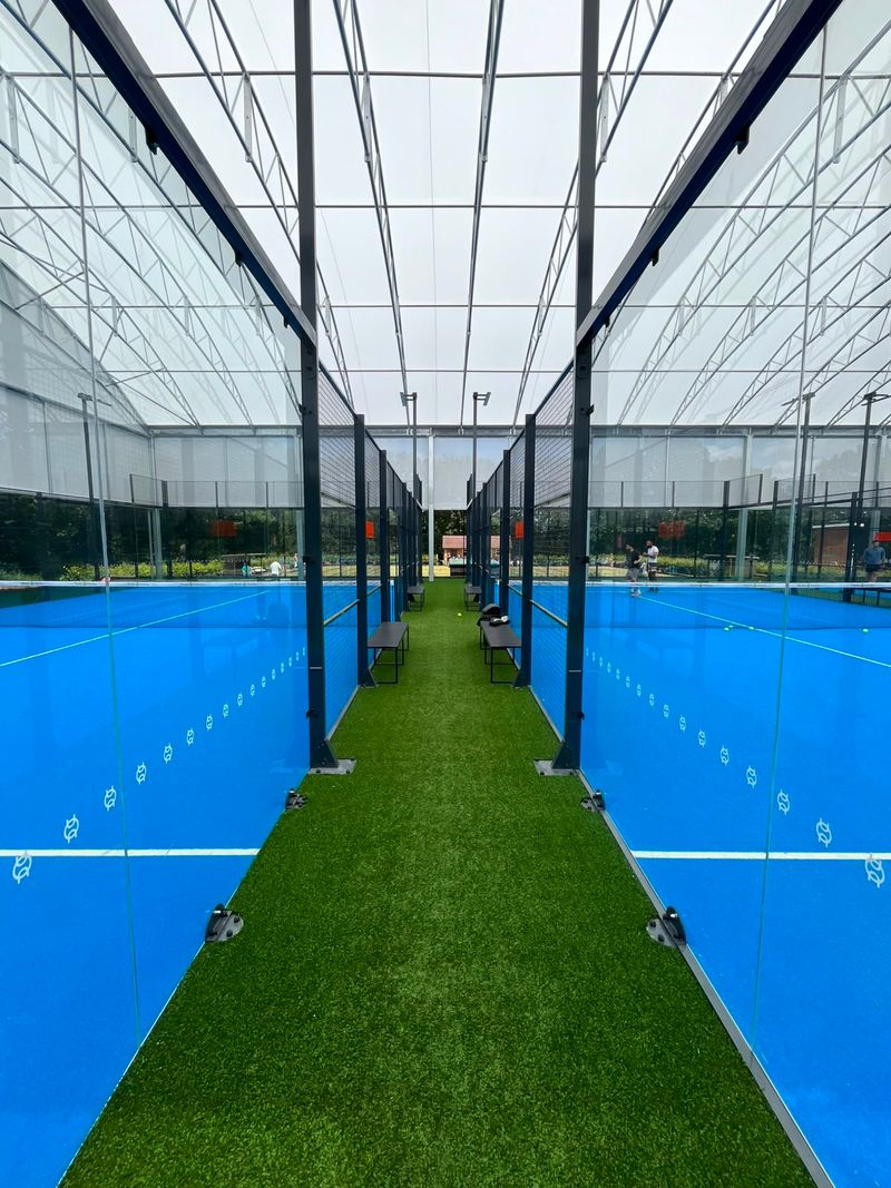 Pure Padel showing the main courts with external lighting and fire alarm 