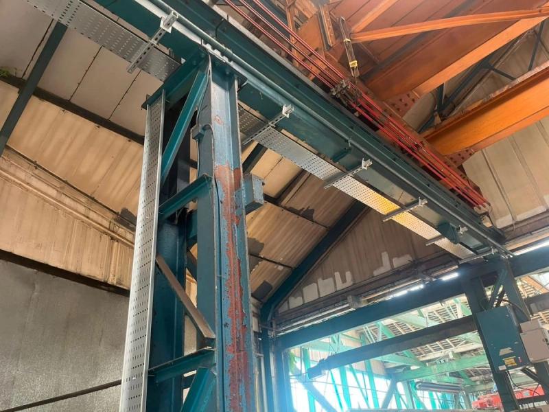 Electrical containment installed at high level in warehouse