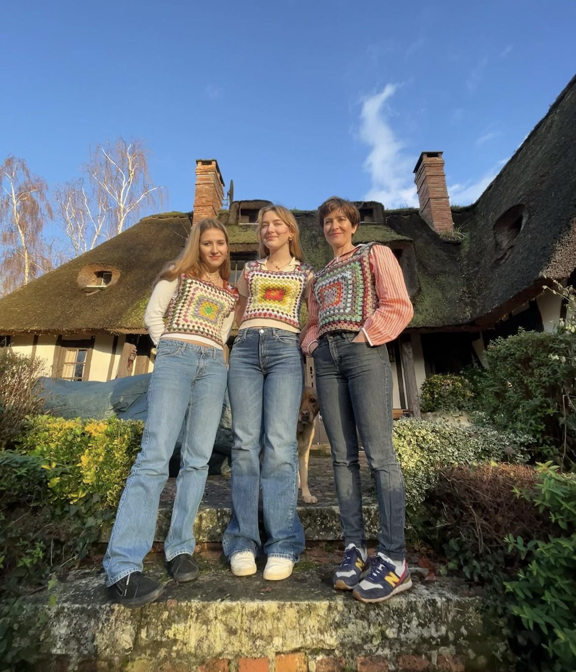 three people wearing crochet vests