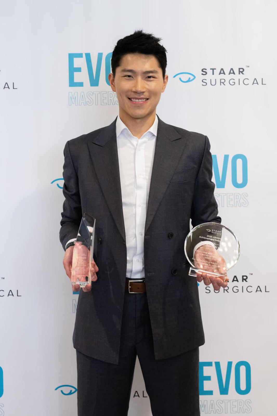 Dr. Joseph Ling holding STAAR Surgical awards