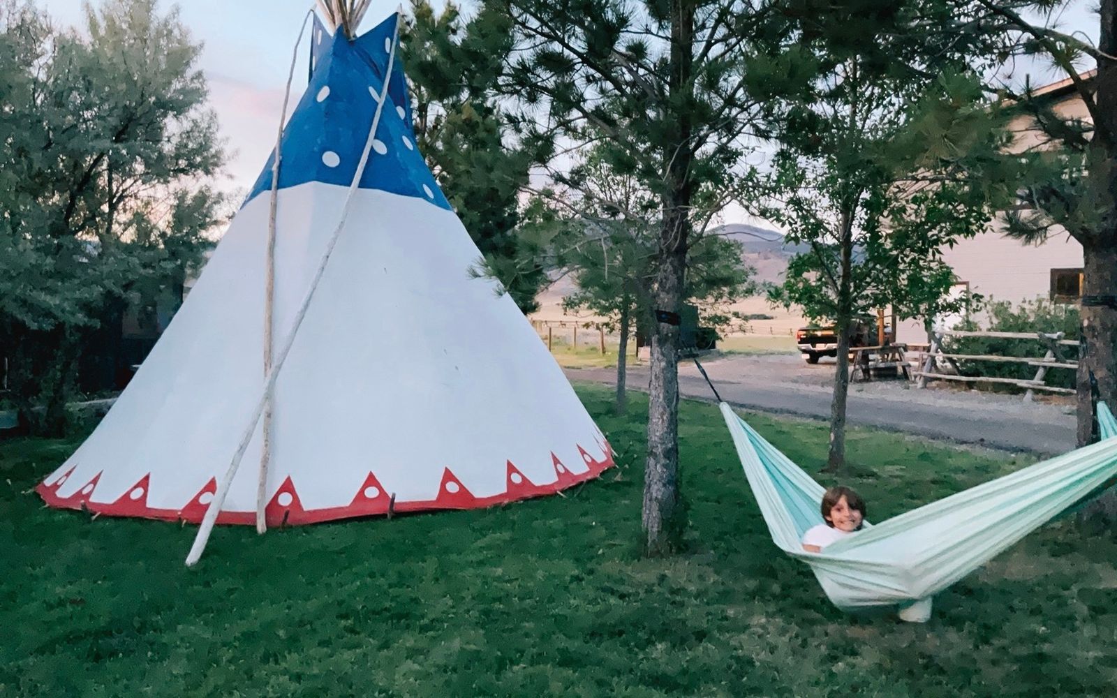 Relaxing in a hammock beside the tipi on a summer evening