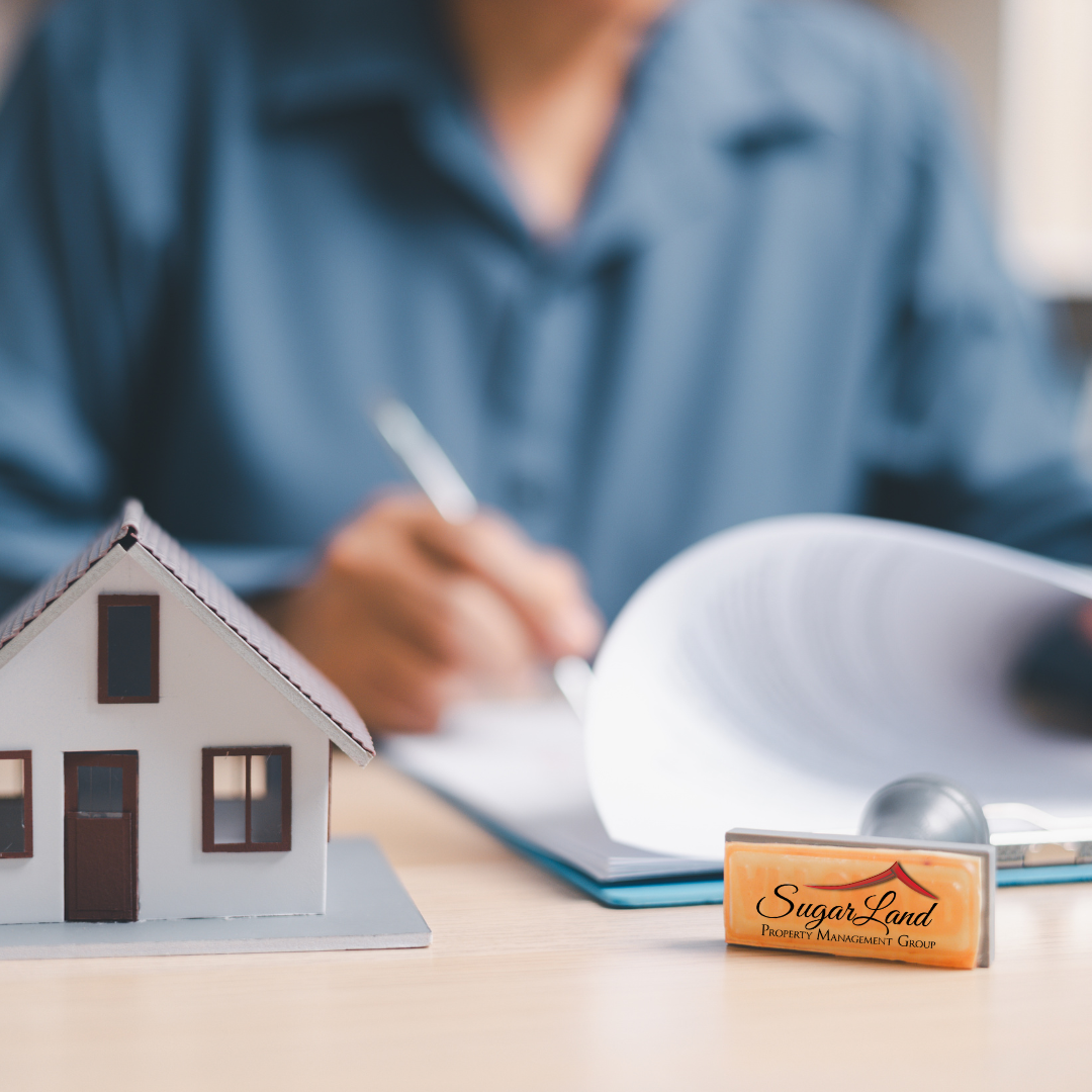 Property manager reviewing tenant screening documents for a Richmond TX rental property