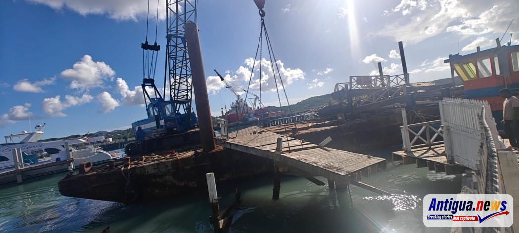 A crane positioned alongside the St. John’s waterfront boardwalk as rehabilitation works begin.