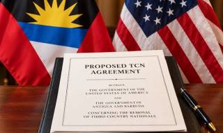 Picture Shows a Agreement and two country flags
