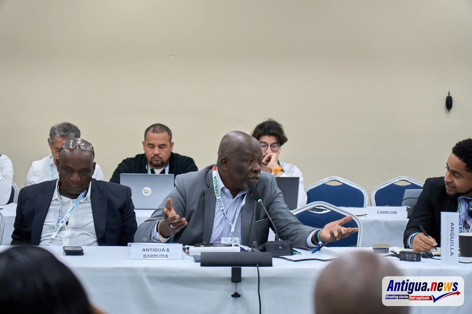 Minister Nicholas in discussions at the 35th CWWA Conference in Grenada
