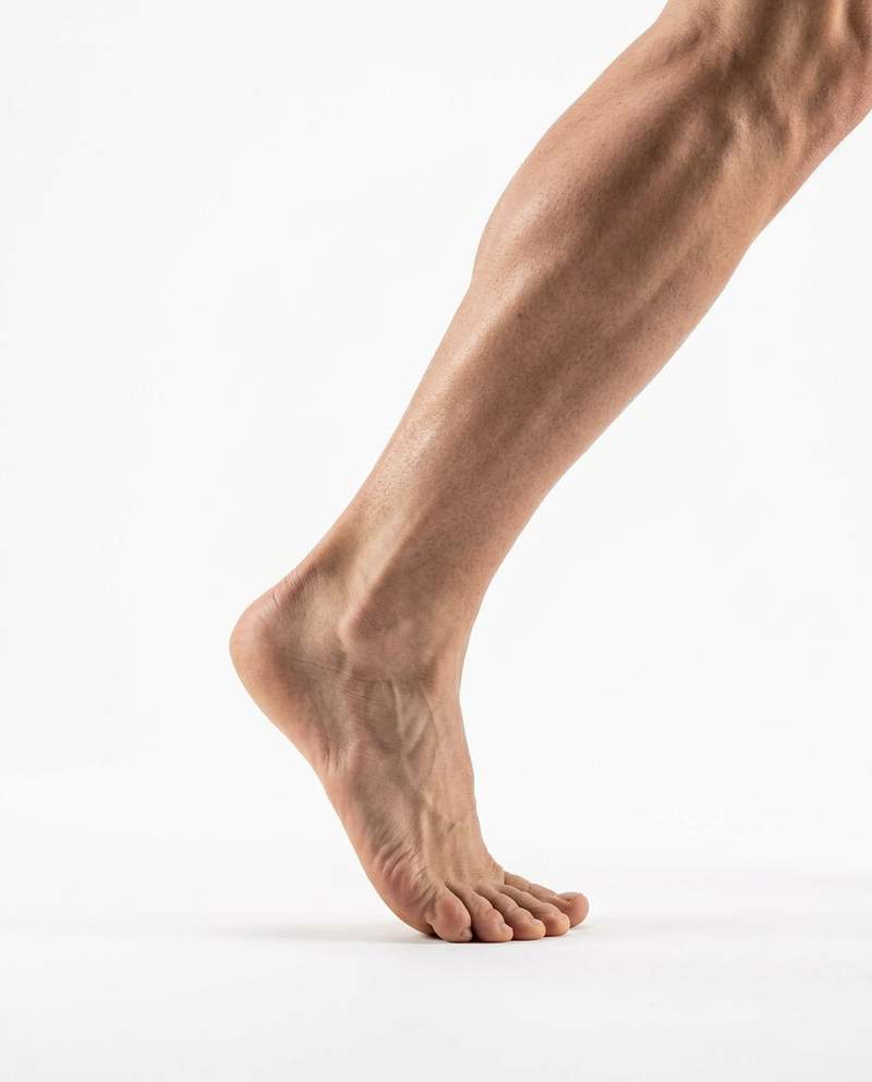 Bare foot pushing off mid-step