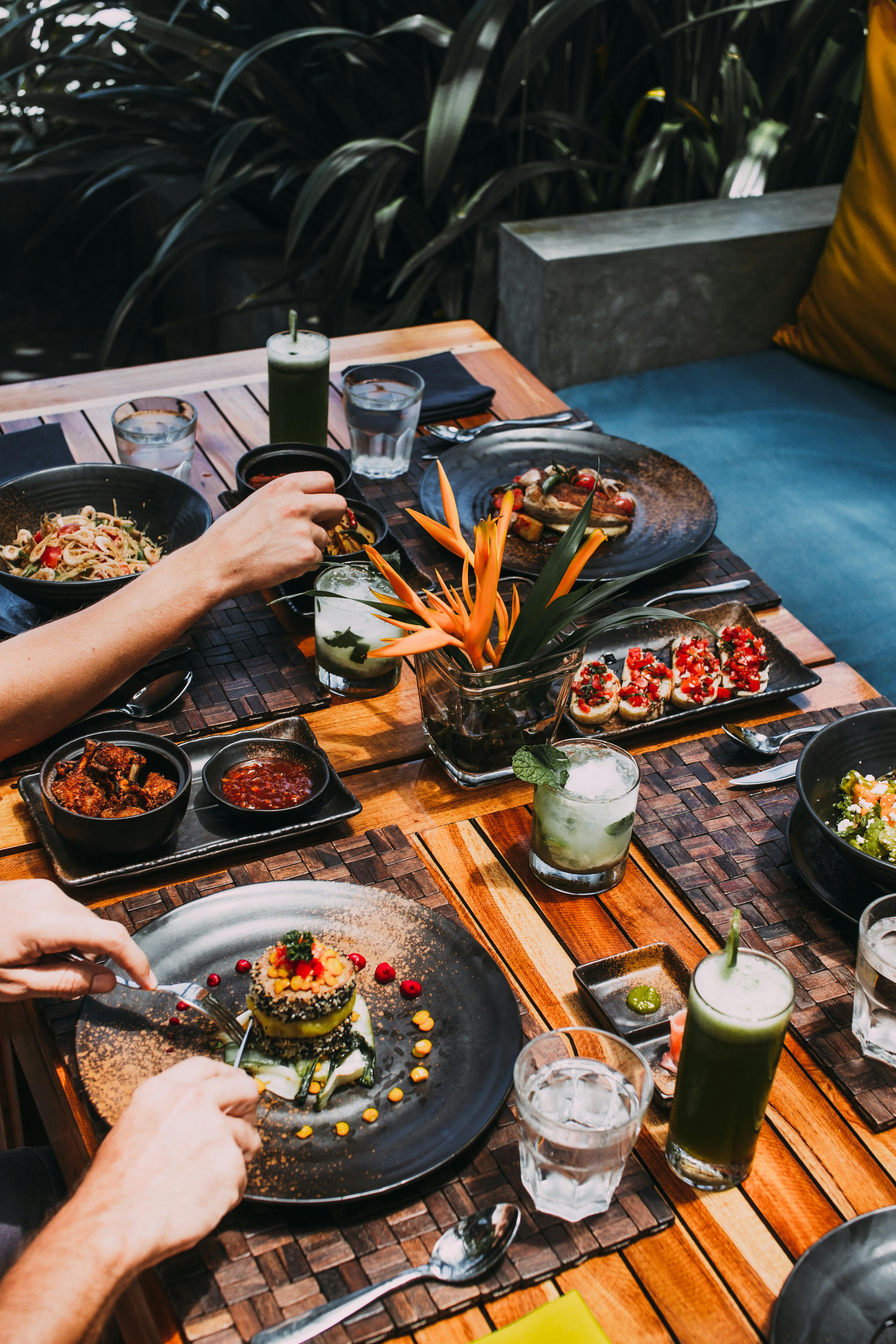 An Uluwatu dining table with fire-led summer food.
