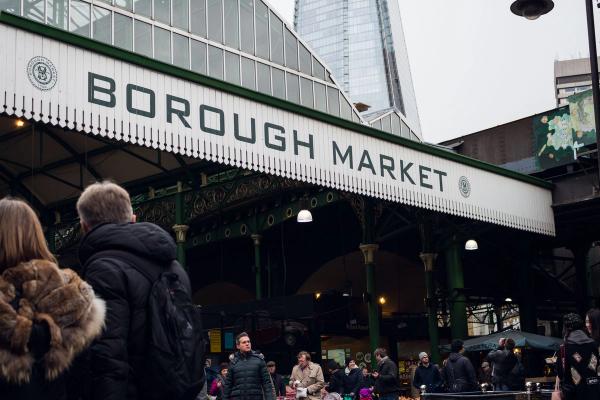 People moving through Borough Market in London