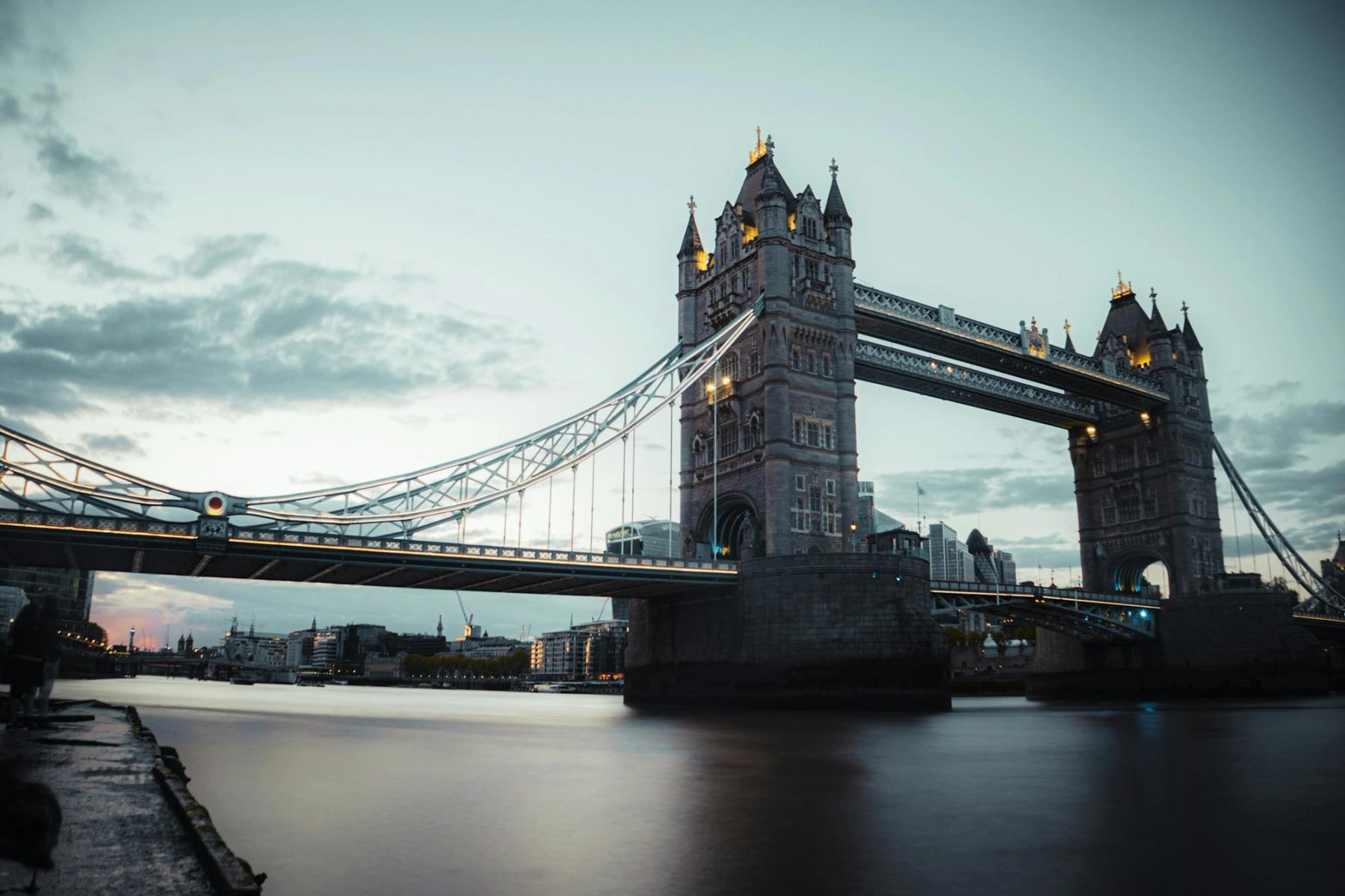Tower Bridge illuminated above the Thames after dusk