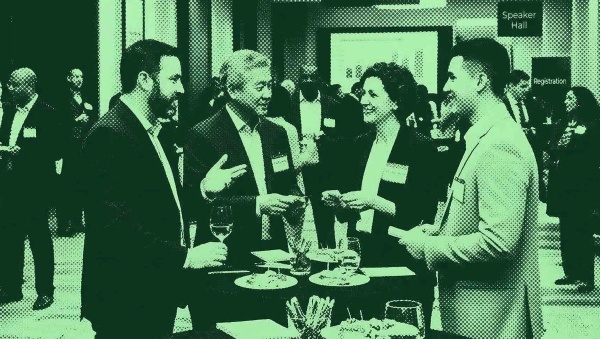 Financial advisors networking at an event. 