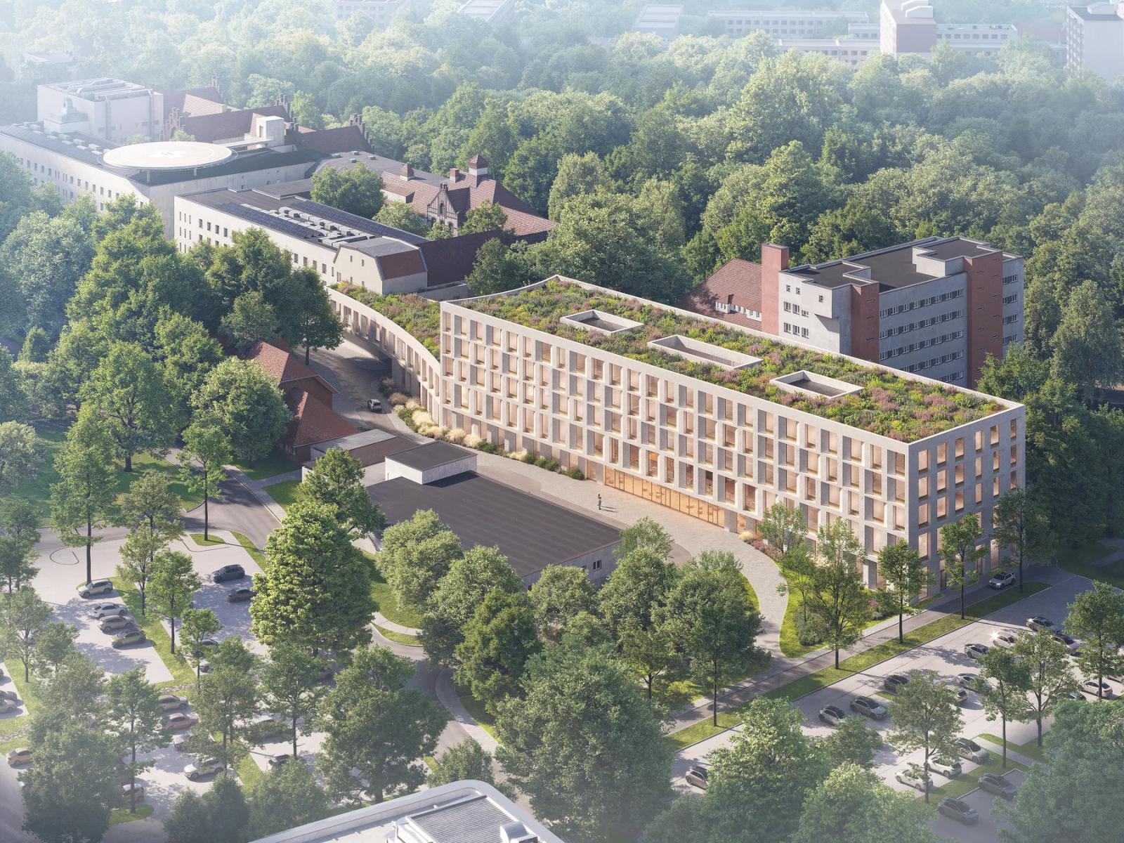 Widok z lotu ptaka — kompaktowa bryła Centrum Onkologii, park i relacja z kampusem szpitalnym.