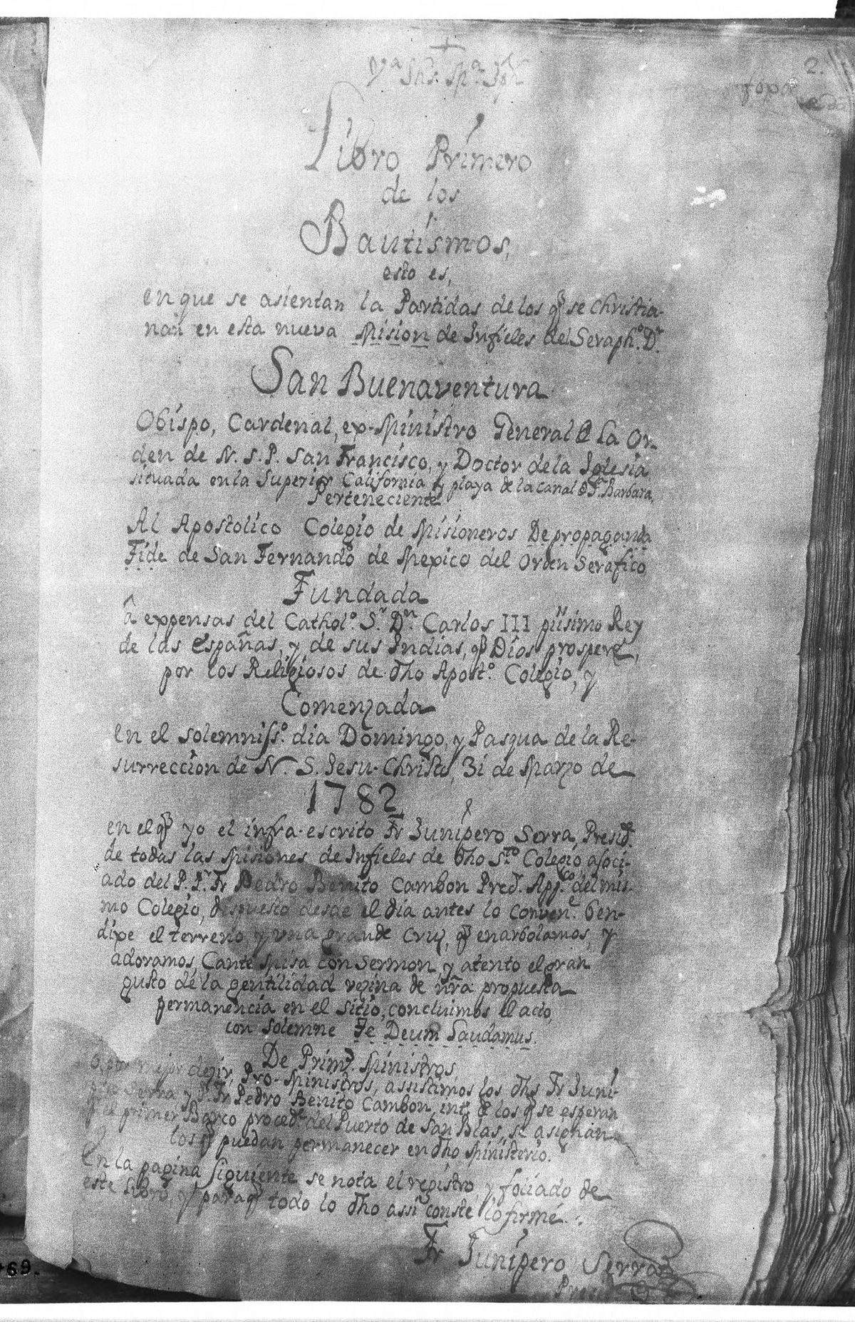 A black-and-white photograph of a handwritten Spanish title page headed Libro Primero de los Bautismos, with the year 1782 in large numerals and Junípero Serra's signature at the bottom.