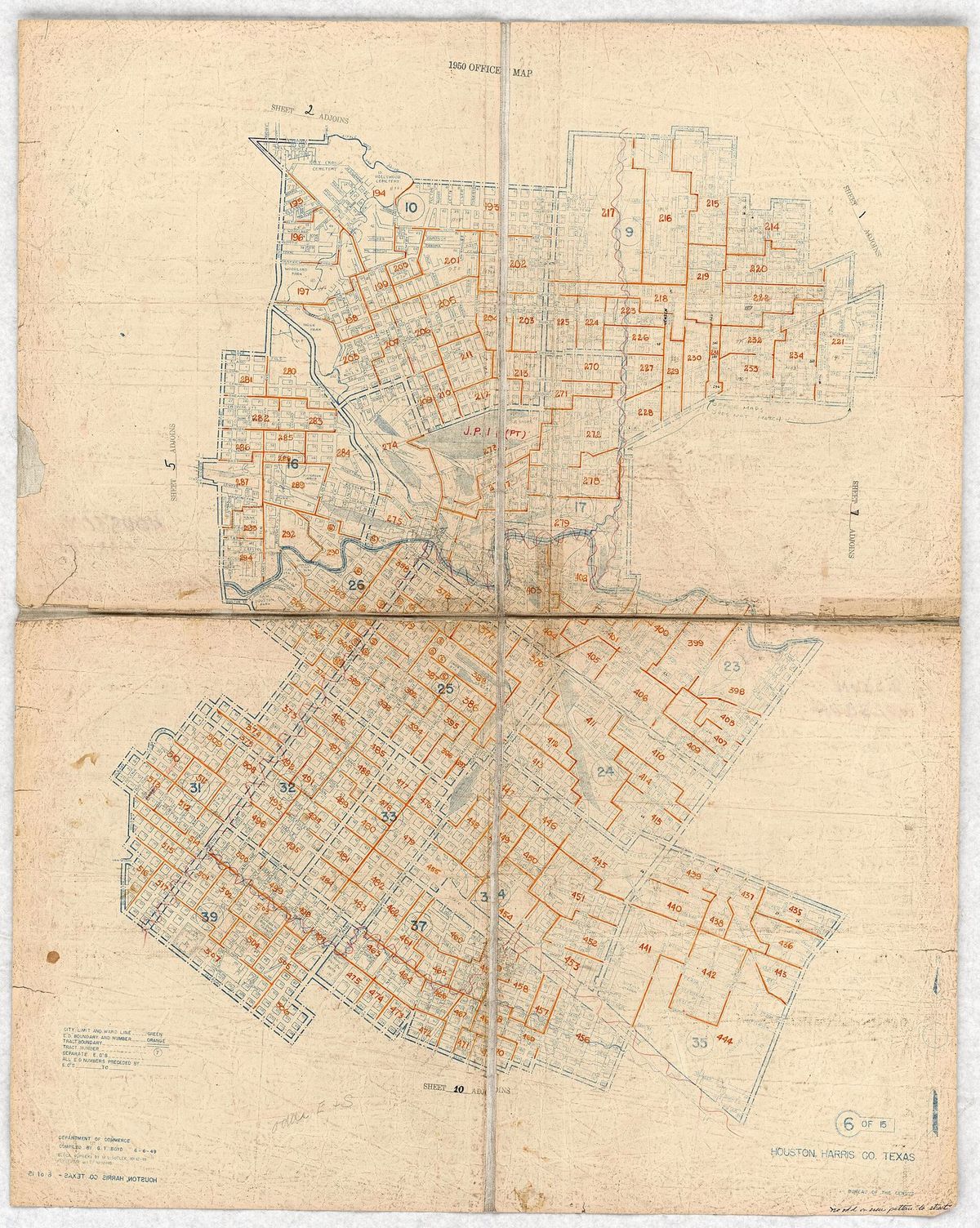 A creased 1950 Census Bureau map of Houston with orange district numbers over blue street blocks.