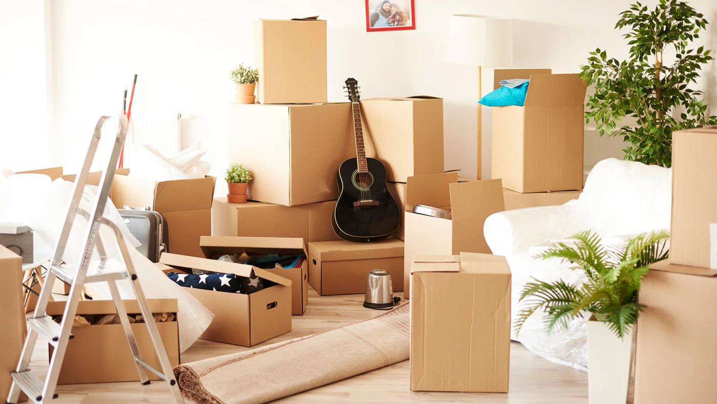 Top view of messy and full of moving boxes