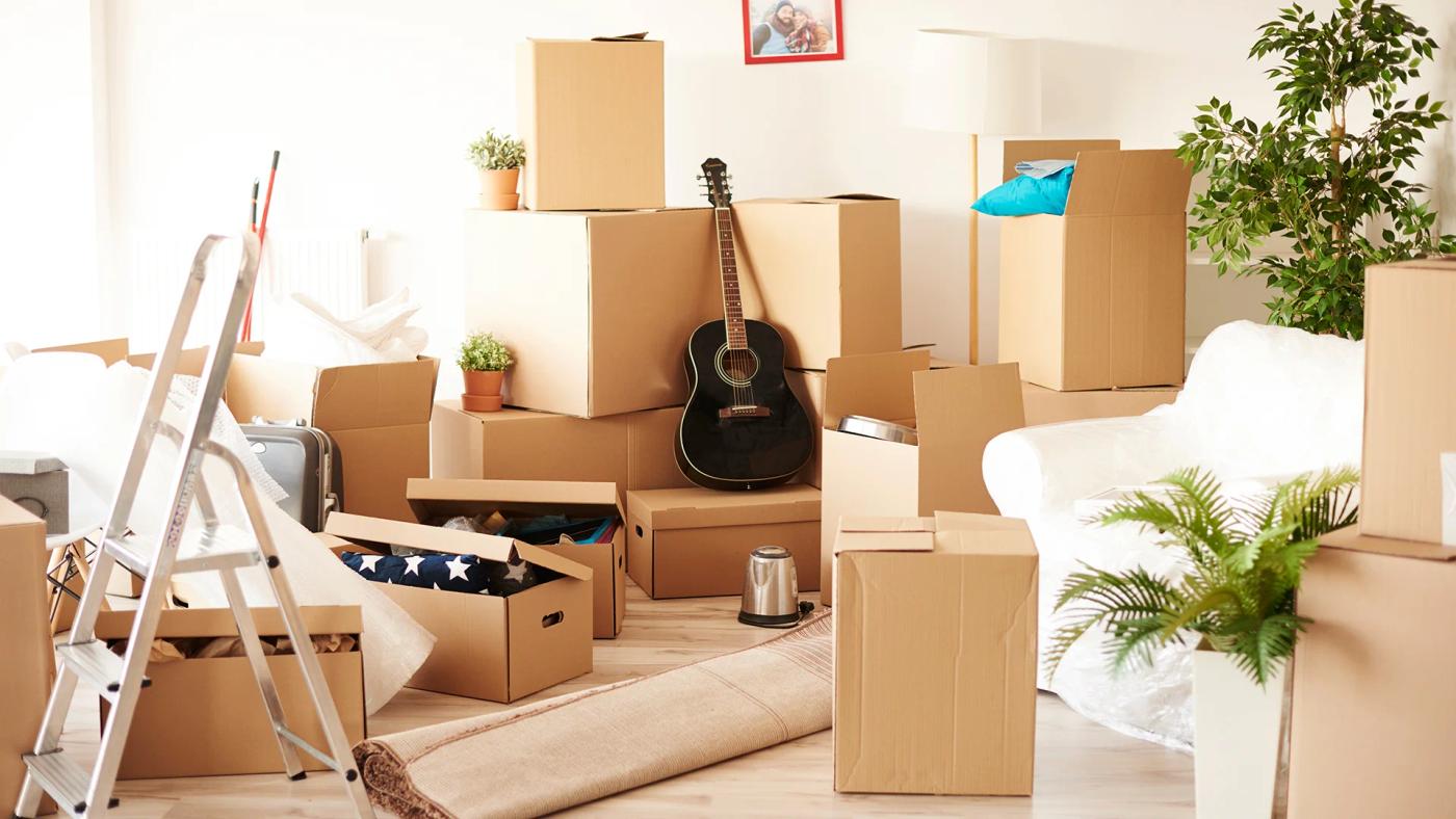 Top view of messy and full of moving boxes