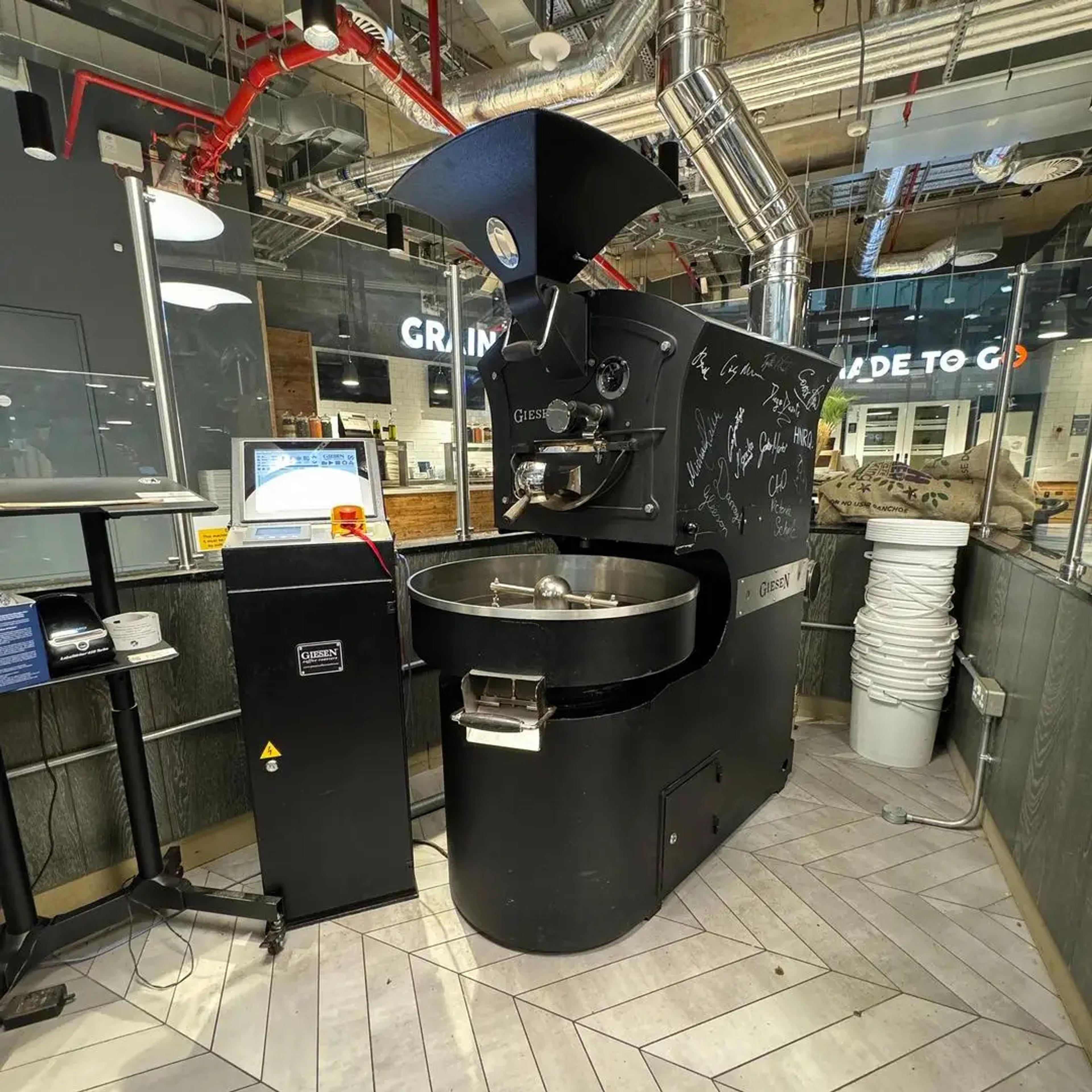 A serviced used Giesen coffee roaster installed and running in a café