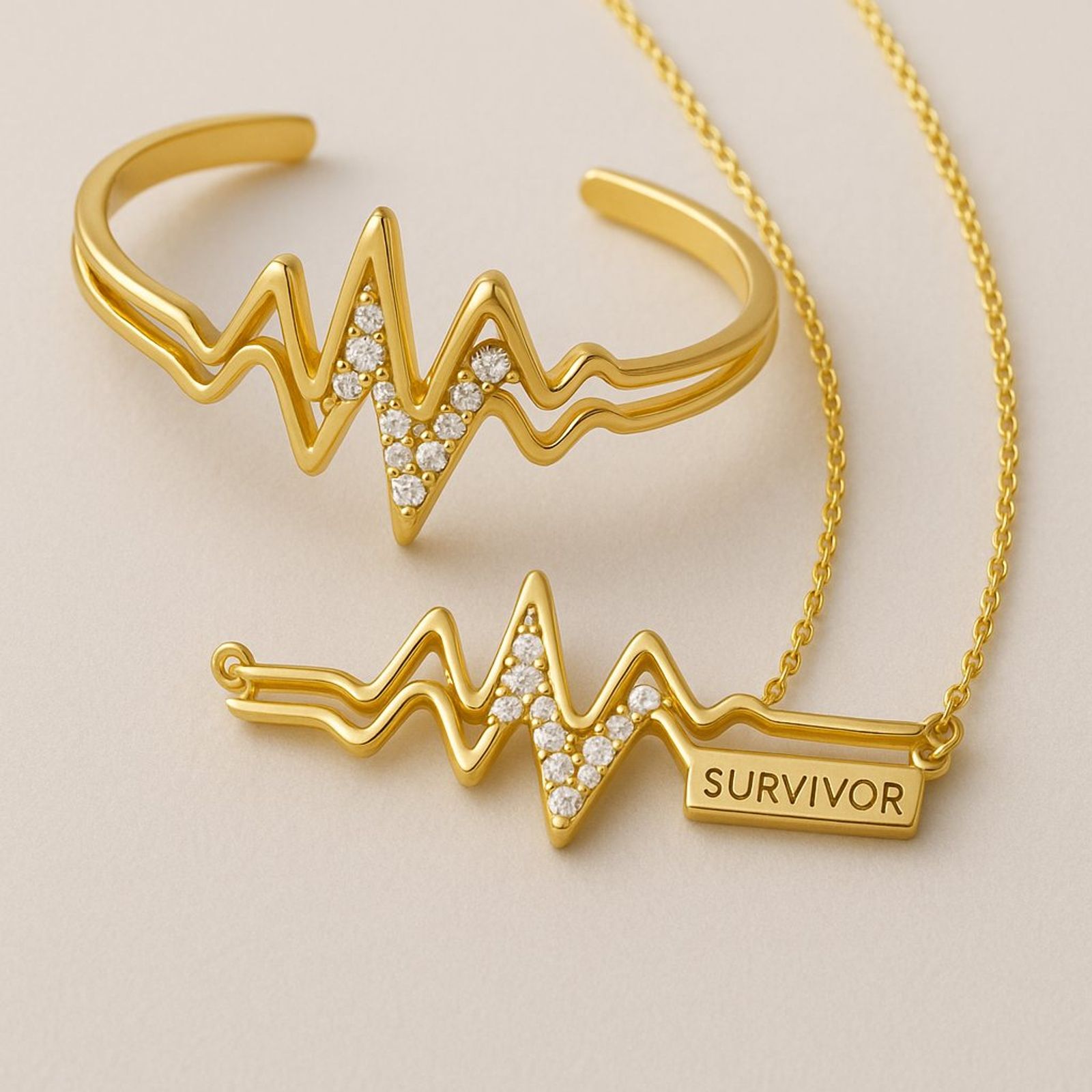 Heartbeat-armring och halsband i guld med EKG-linje och stenar