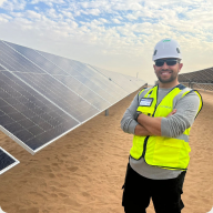 Engineer inspecting solar panels