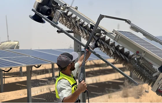 Automated cleaning robot maintaining solar panels in operation