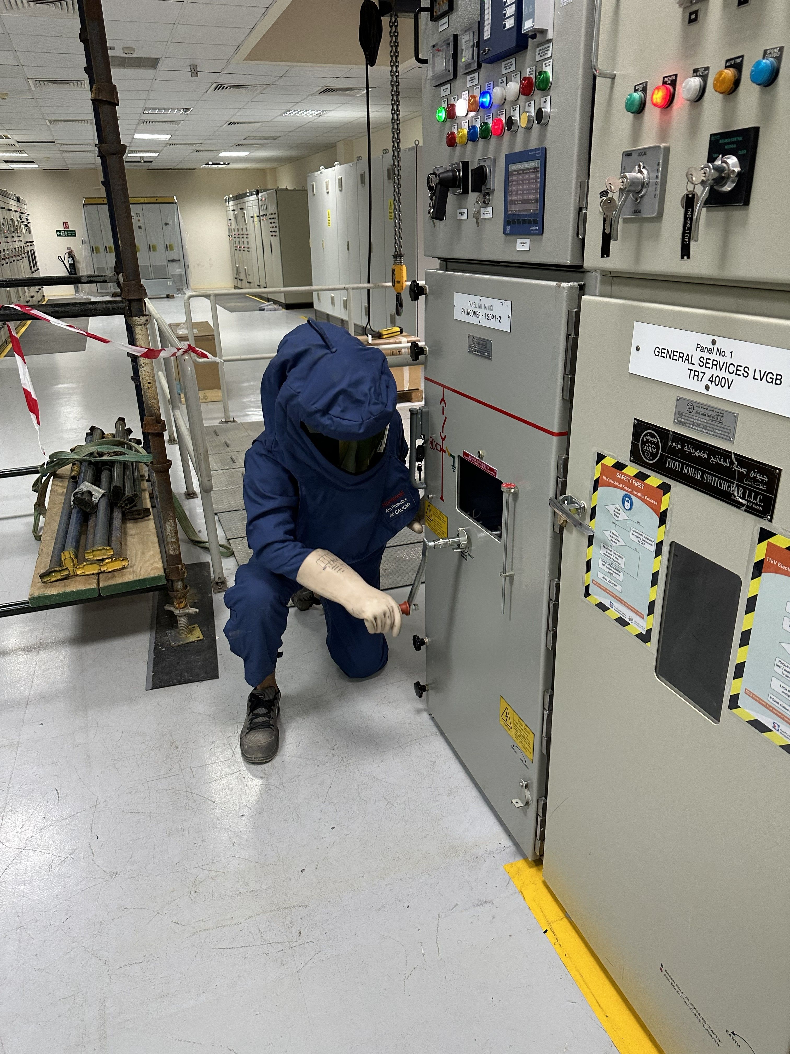 Technicians connecting electrical cabling on a solar panel array