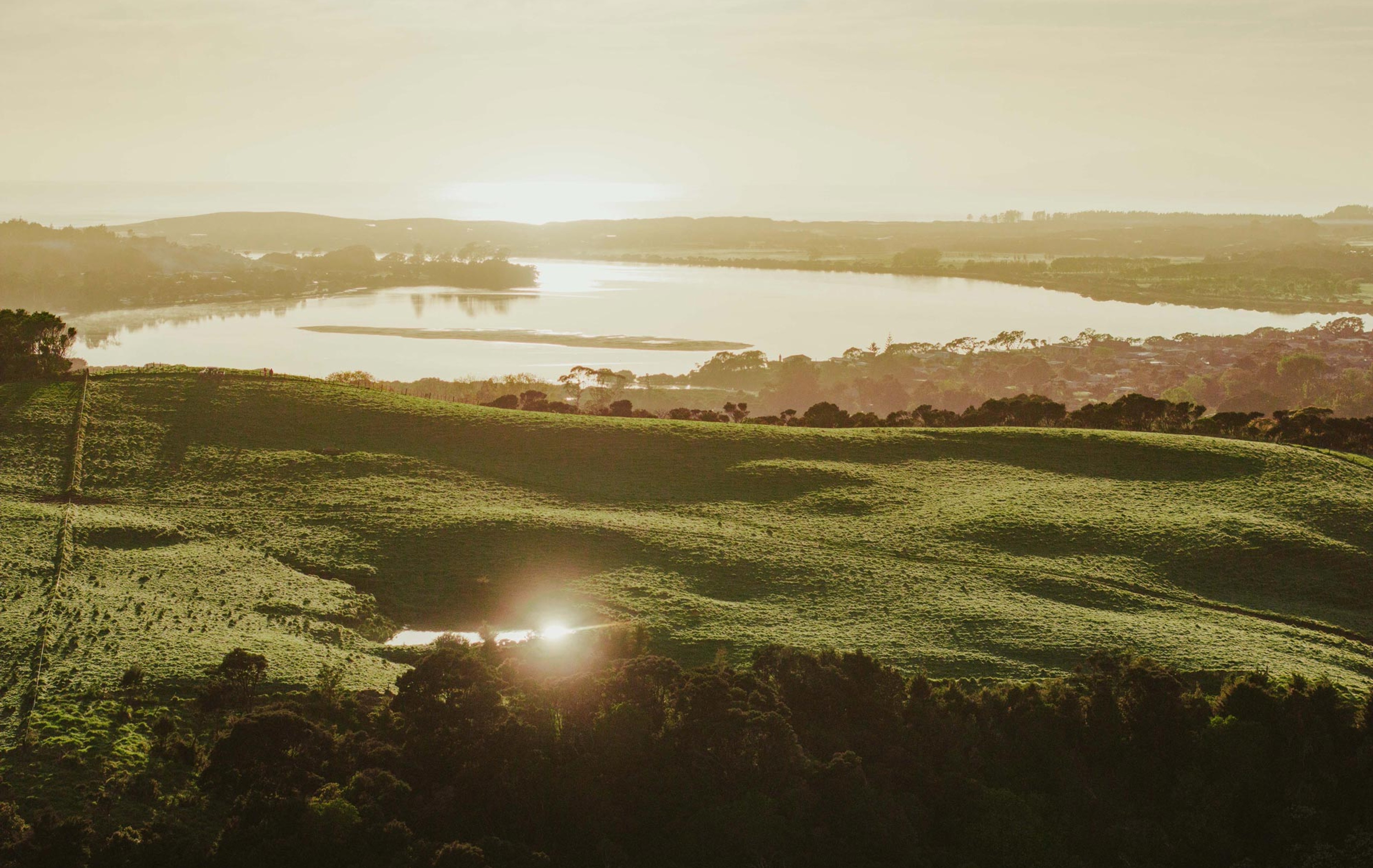 Sun rising over the hills at Mangawhai Hills