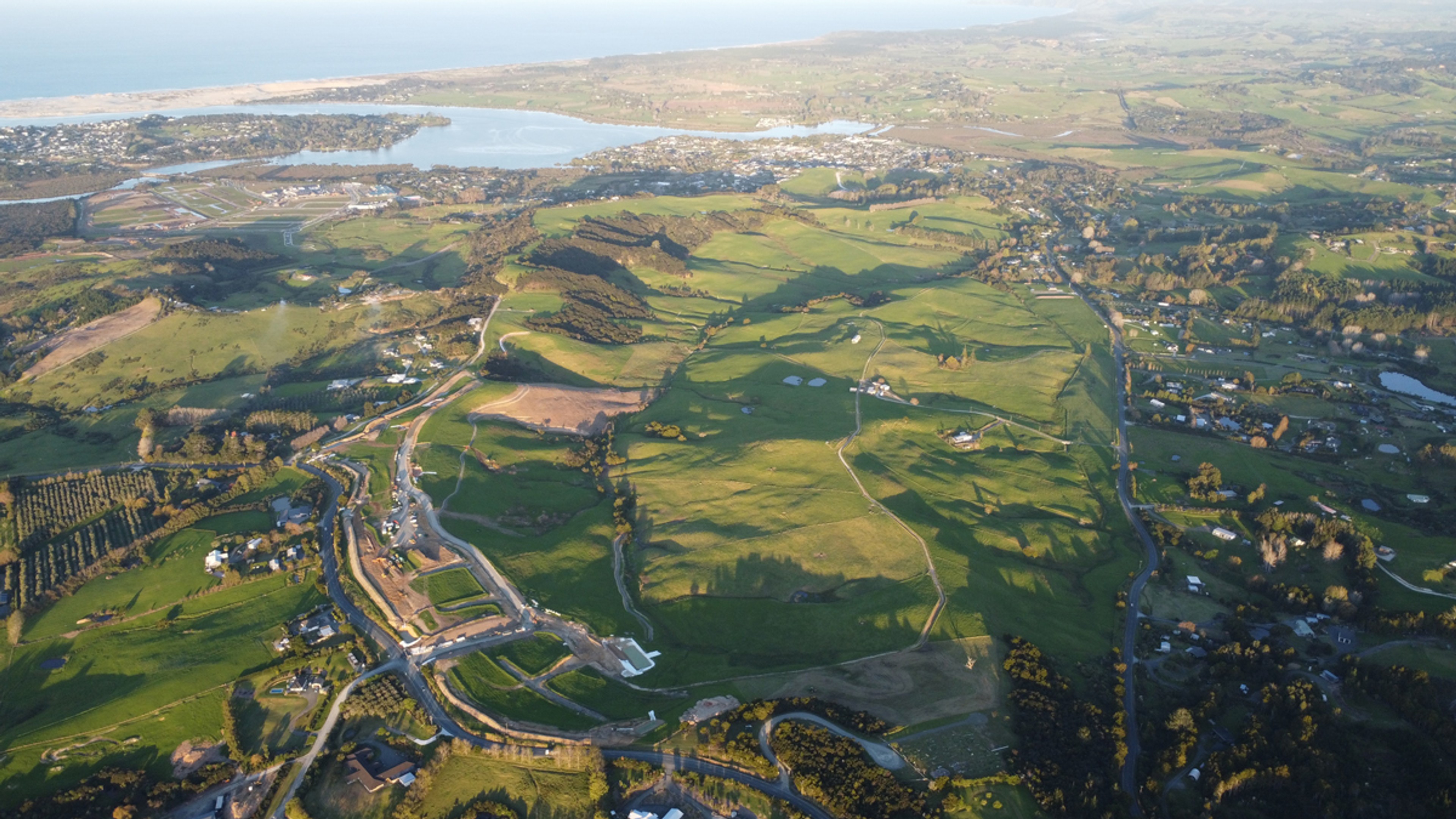 Mangawhai Hills College students planting native trees along the College Walkway