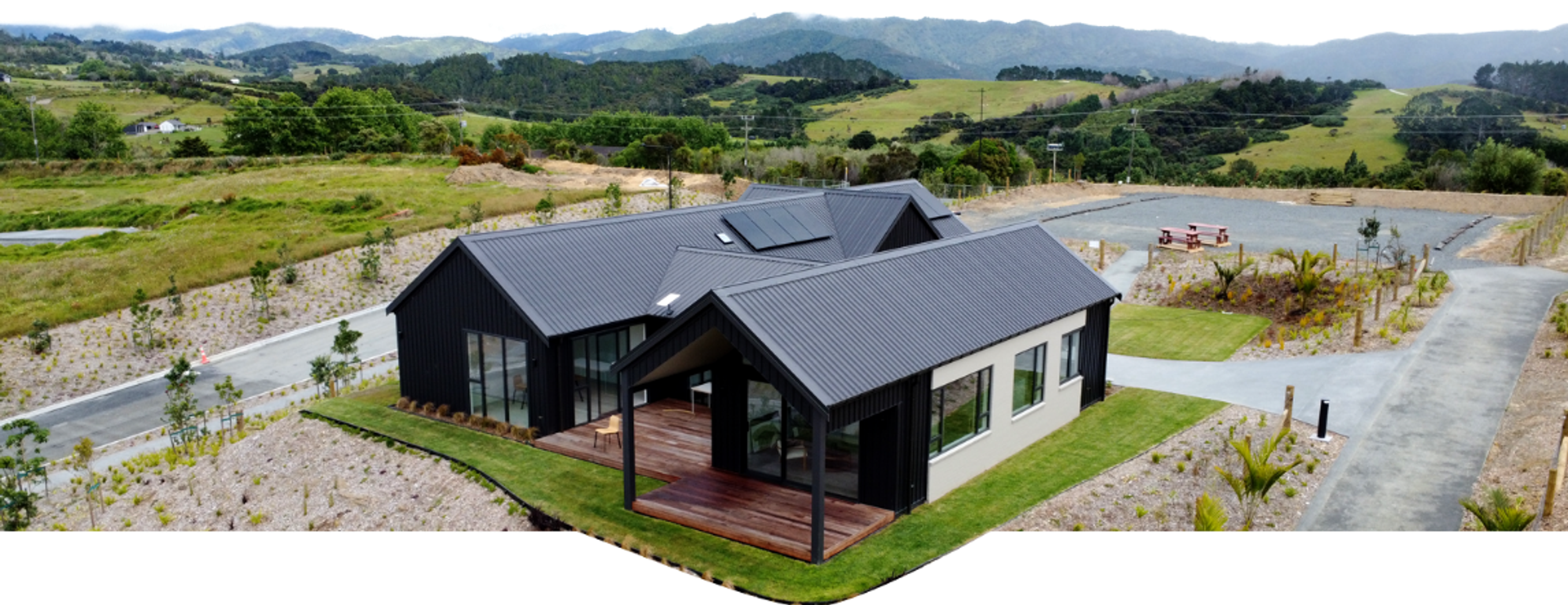 The Mangawhai Hills Experience Centre at Cove Heights with newly sealed roads and native planting