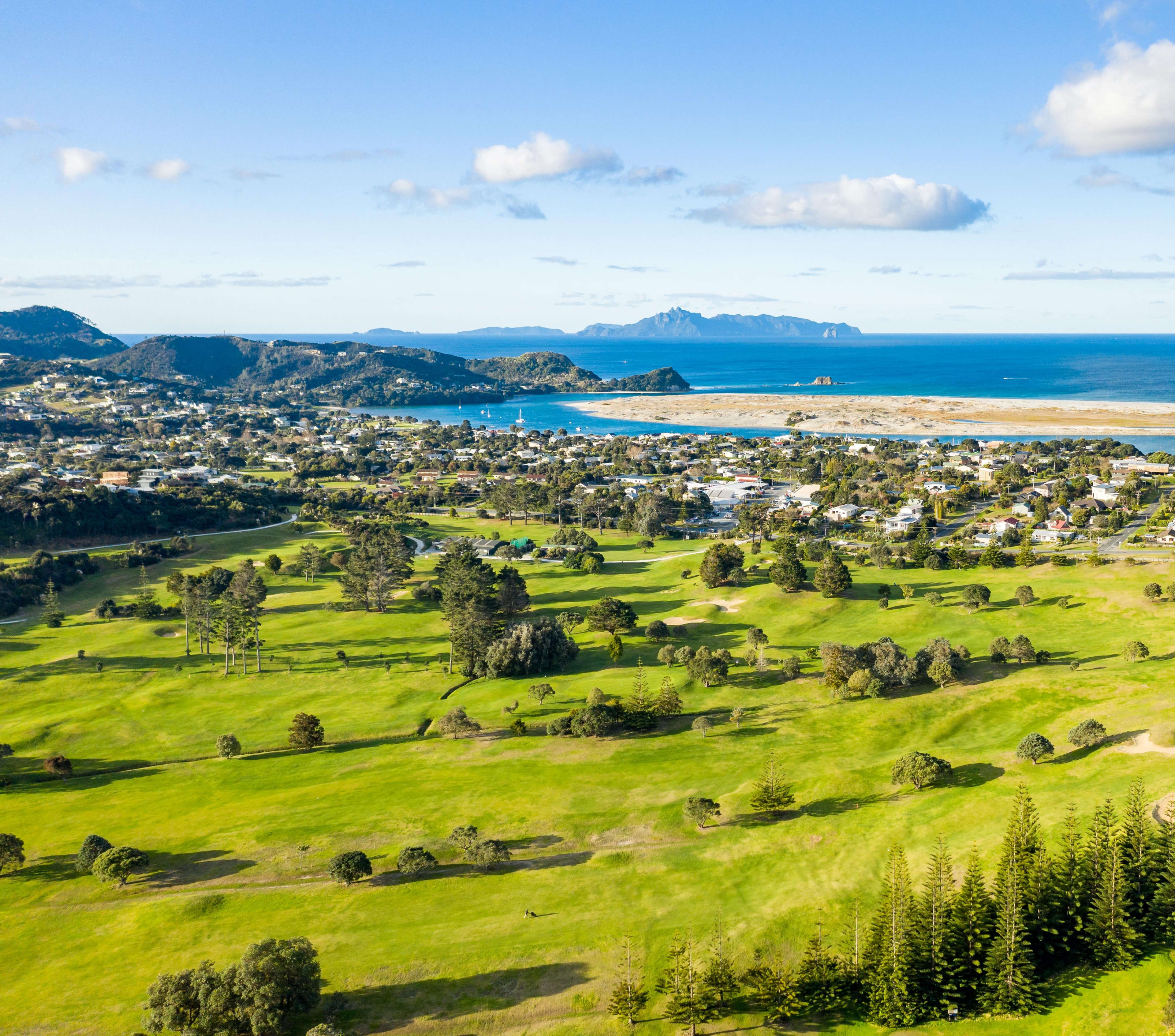 Aerial view over the Mangawhai golf course to the village and coast