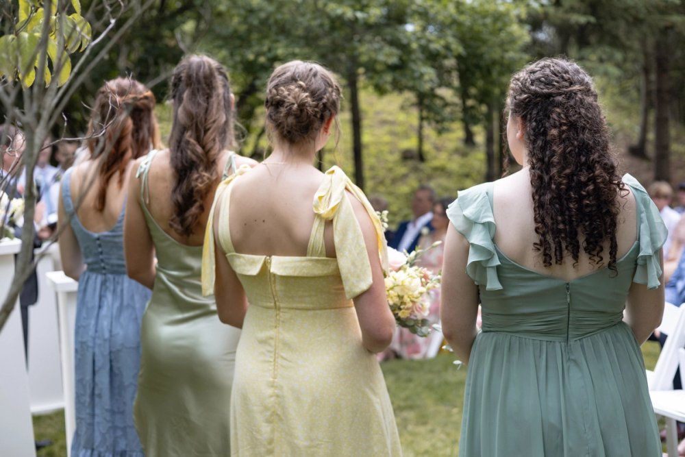 Bridesmaids holding pastel bouquets during Kurtz Orchards wedding