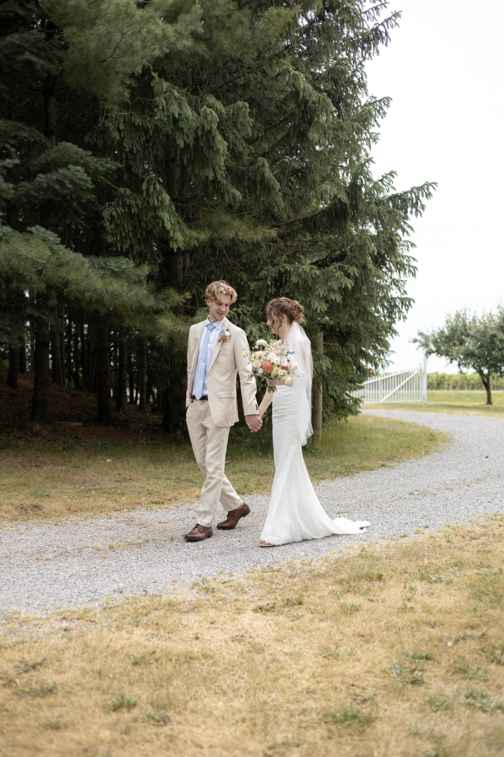 First look portrait along gravel path