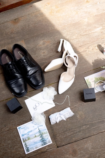 wedding flatlay including bride and groom dress shoes, stationary and details - Tobermory Elopement Photography