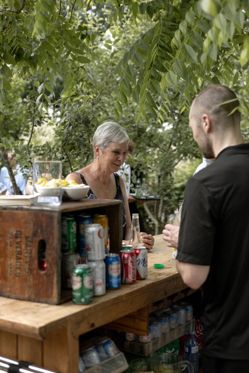 Guest getting a drink from bar at Kurtz Orchards wedding during cocktail hour