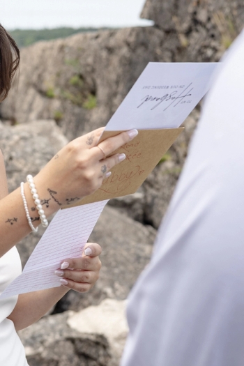 bride holding letter with written vows - Tobermory elopement photography